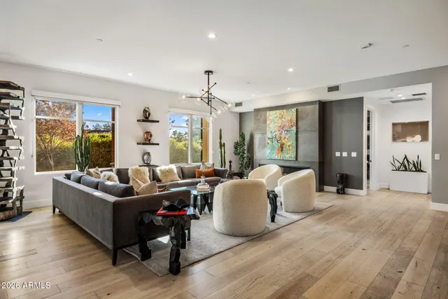 a living room with furniture and a large window