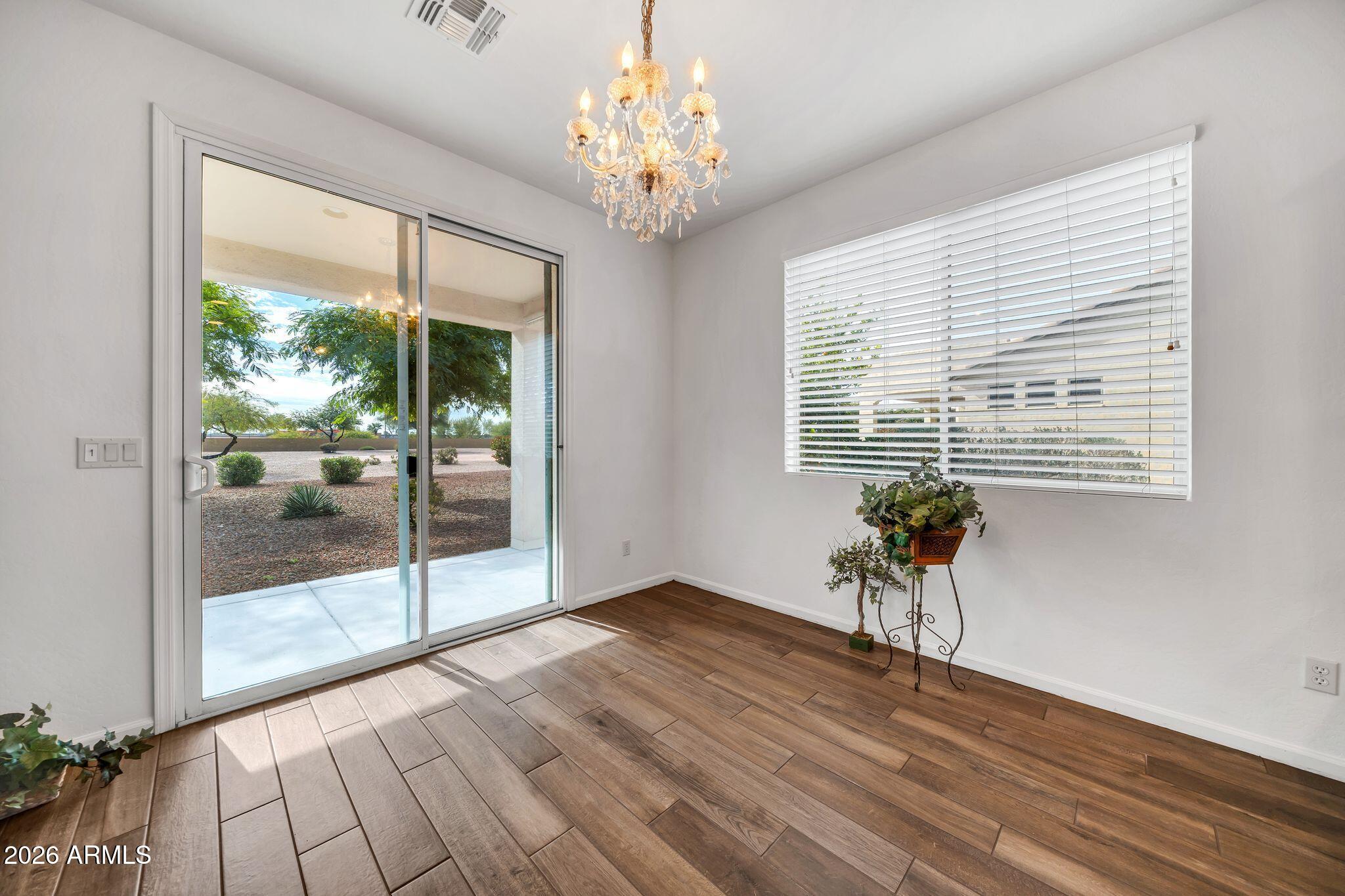 16435 West Berkeley Road Goodyear, AZ 85395 - Photo 9 of 52 a view of an empty room with a window