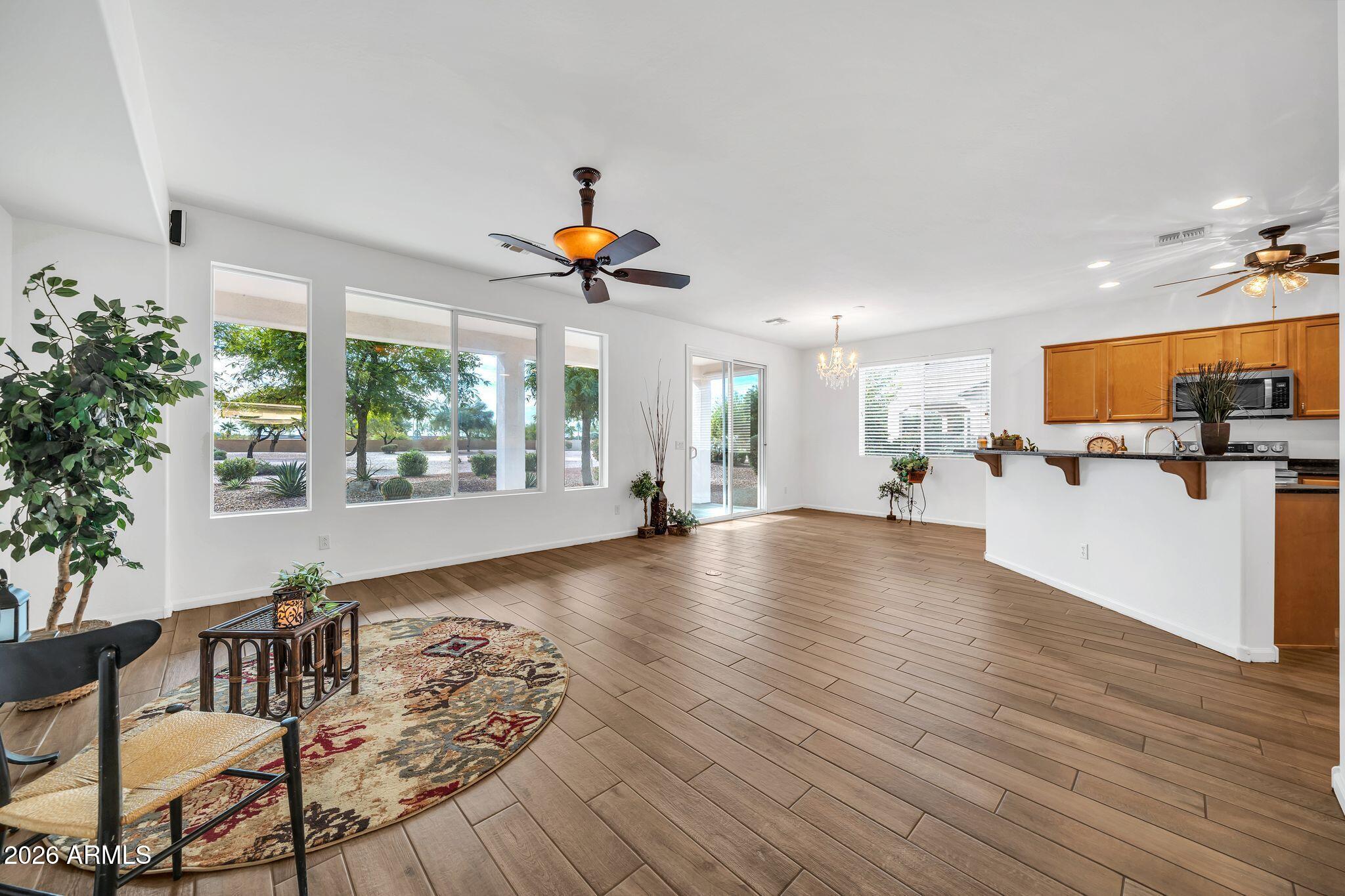 16435 West Berkeley Road Goodyear, AZ 85395 - Photo 11 of 52 a view of a living room and a wooden floor