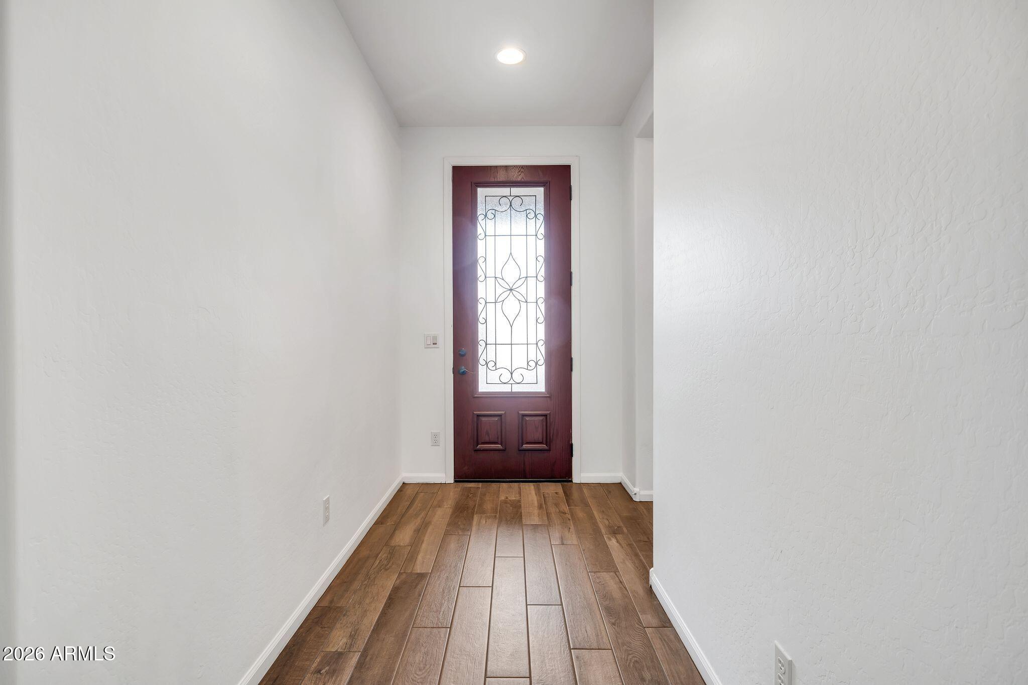16435 West Berkeley Road Goodyear, AZ 85395 - Photo 13 of 52 a view of hallway with wooden floor