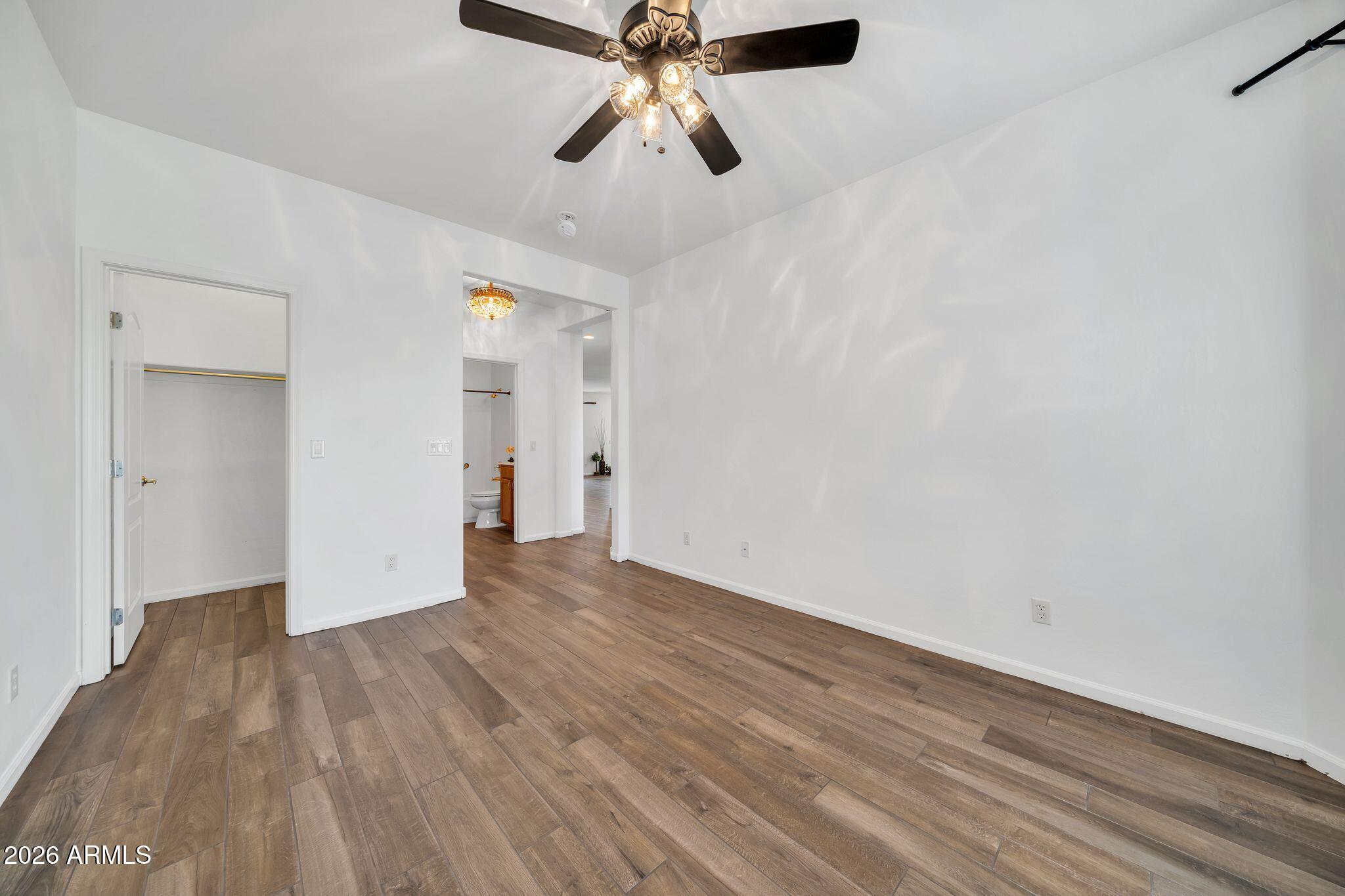 16435 West Berkeley Road Goodyear, AZ 85395 - Photo 17 of 52 a view of empty room with wooden floor
