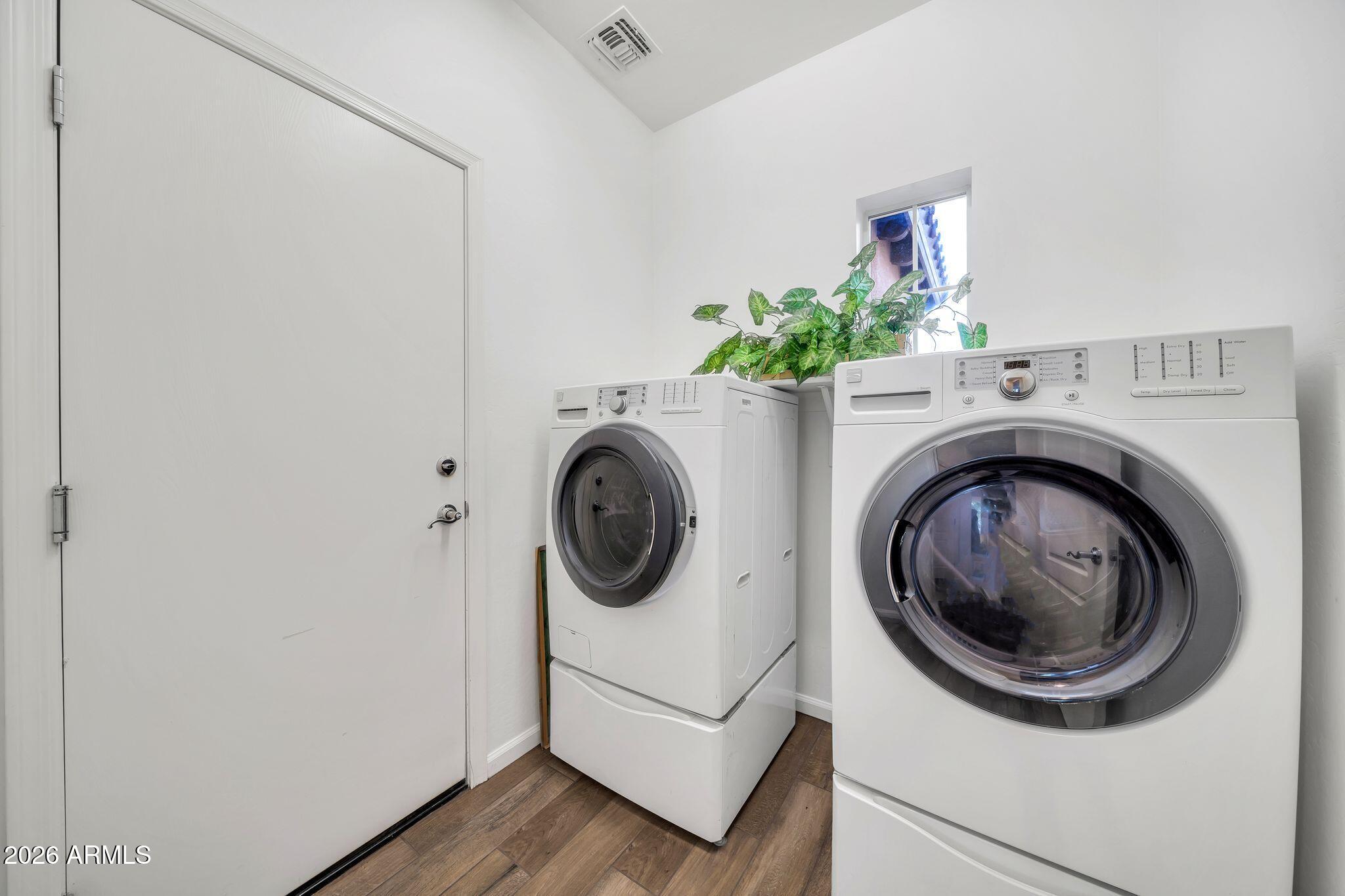 16435 West Berkeley Road Goodyear, AZ 85395 - Photo 21 of 52 a utility room with dryer and washer
