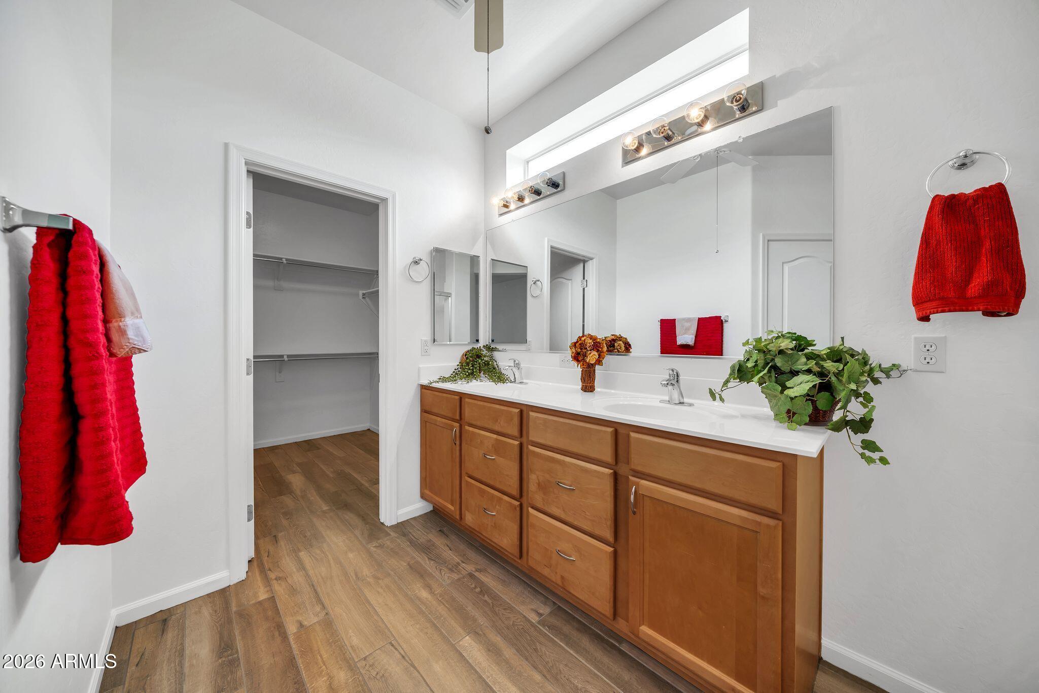 16435 West Berkeley Road Goodyear, AZ 85395 - Photo 25 of 52 a bathroom with a sink and a mirror