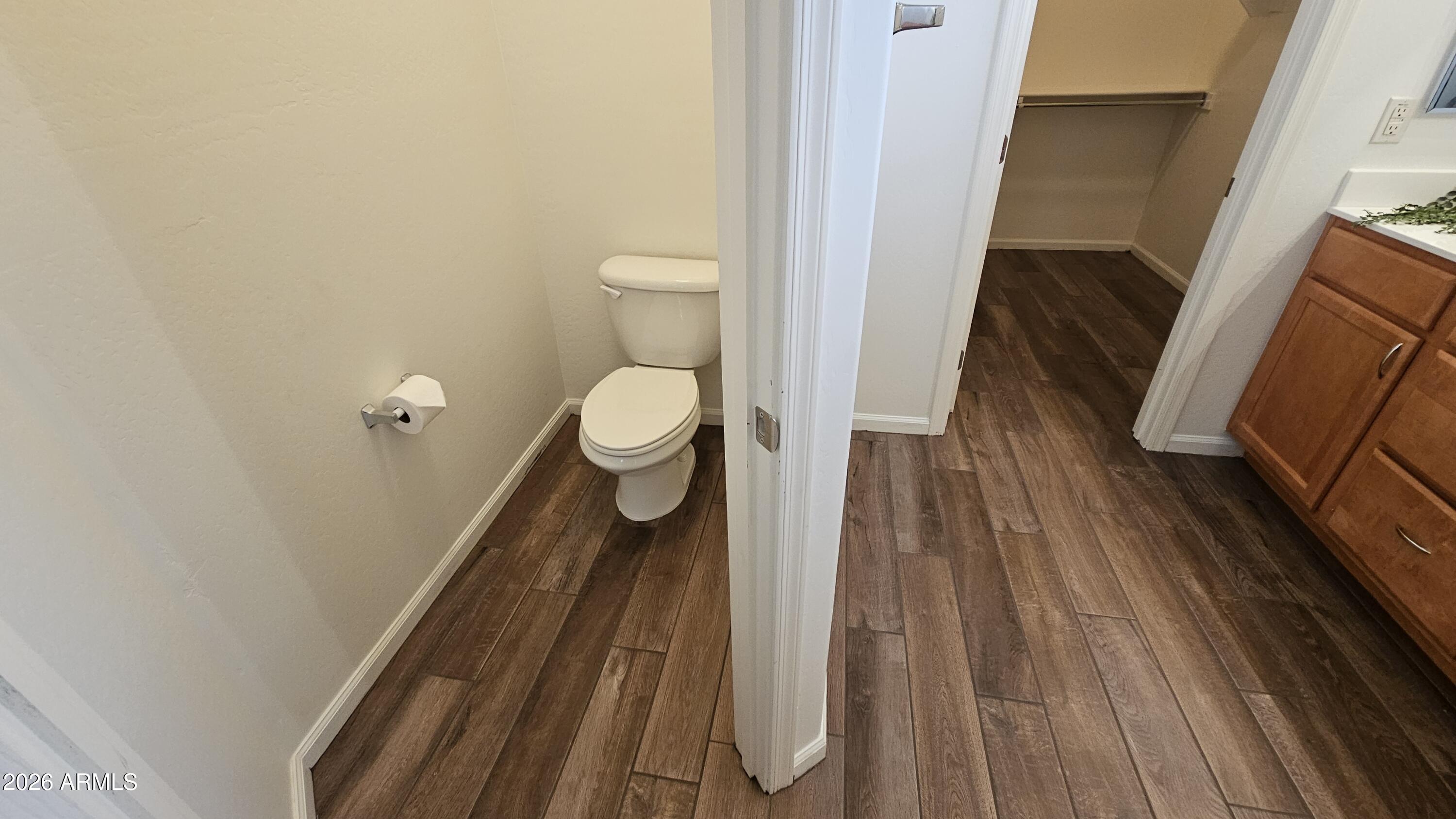 16435 West Berkeley Road Goodyear, AZ 85395 - Photo 27 of 52 a bathroom with a toilet and a shower