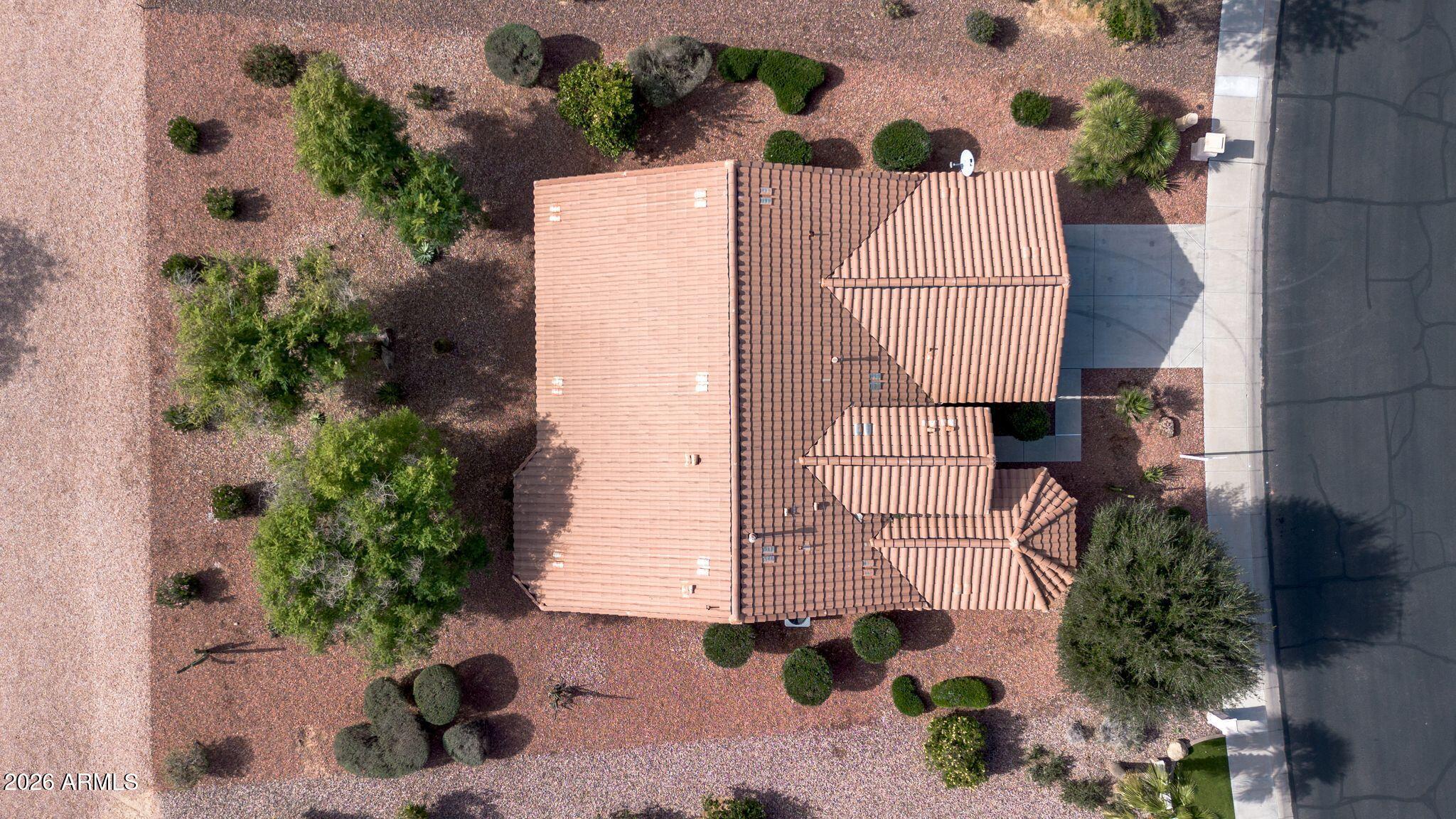 16435 West Berkeley Road Goodyear, AZ 85395 - Photo 39 of 52 a picture of a white house with a potted plant