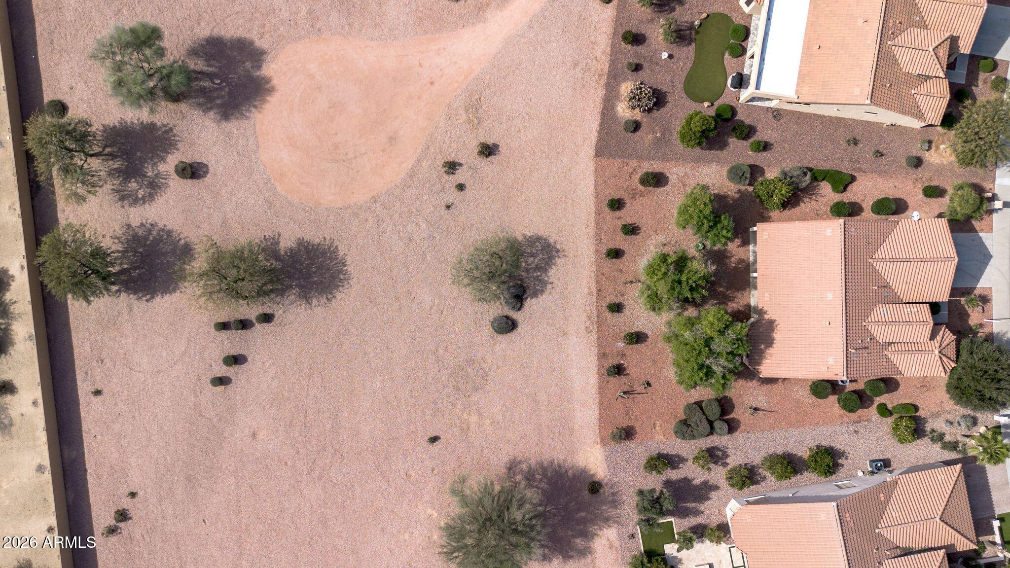16435 West Berkeley Road Goodyear, AZ 85395 - Photo 40 of 52 view of a house with a yard and garden