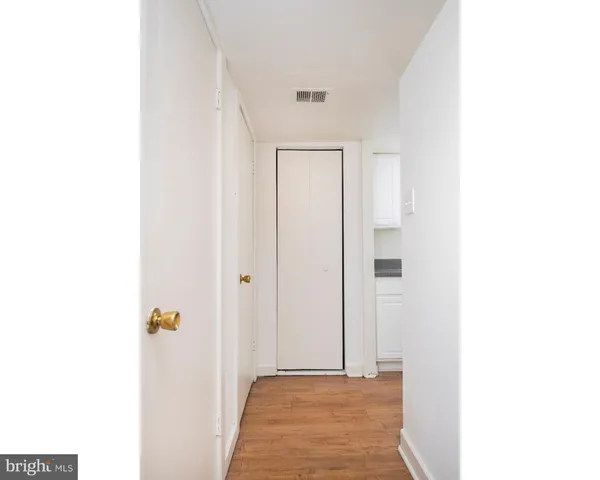 a view of a hallway with closet