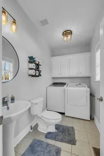 a room with furniture and white walls