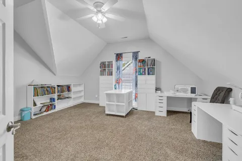 a view of livingroom with furniture and white cabinet