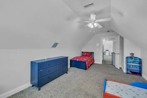 a bathroom with a sink toilet vanity and shower