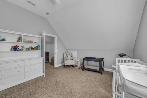 a bedroom with furniture and a window
