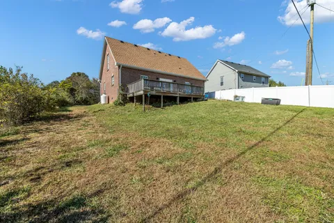 a balcony with furniture and a potted plant