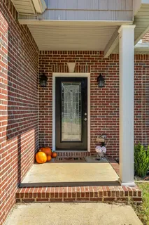 a large white kitchen with a large window