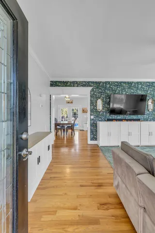 a living room with furniture and a flat screen tv
