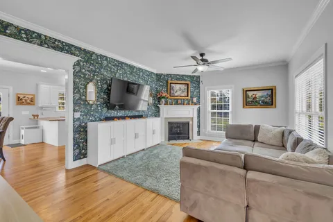 a living room with furniture and a fireplace