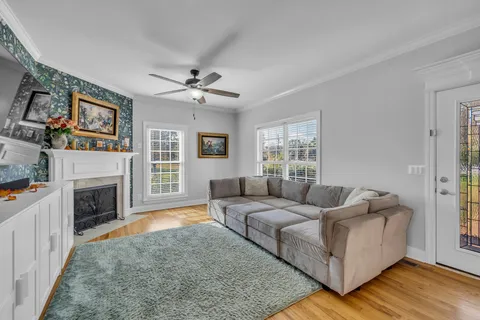 a living room with furniture and a flat screen tv