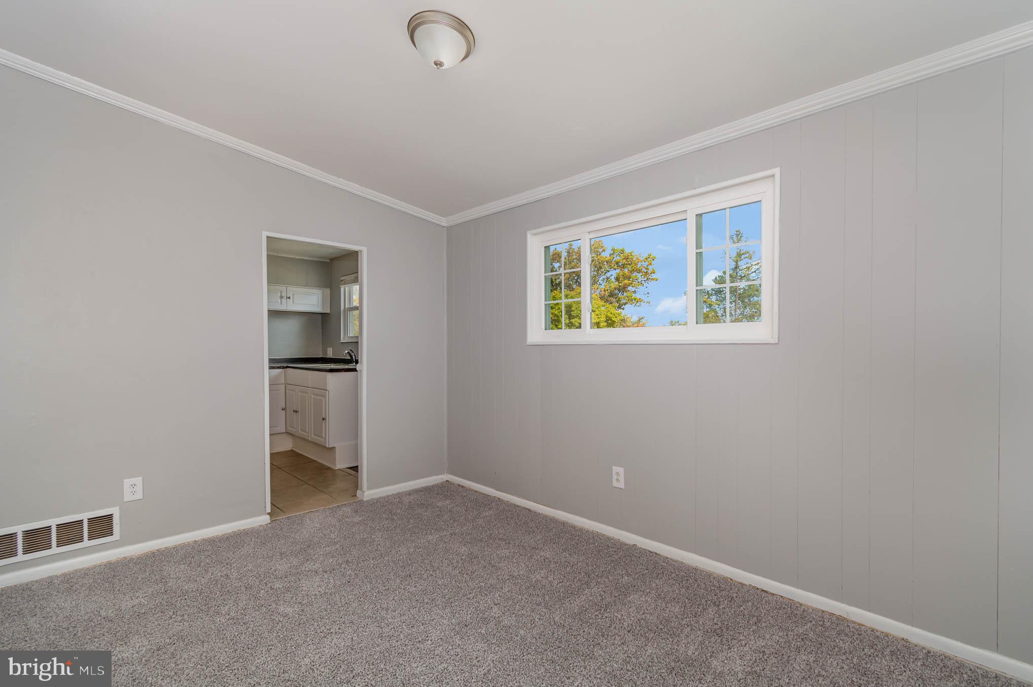 4612 Tema Road Pikesville, MD 21208 - Photo 9 of 27 an empty room with windows and closet