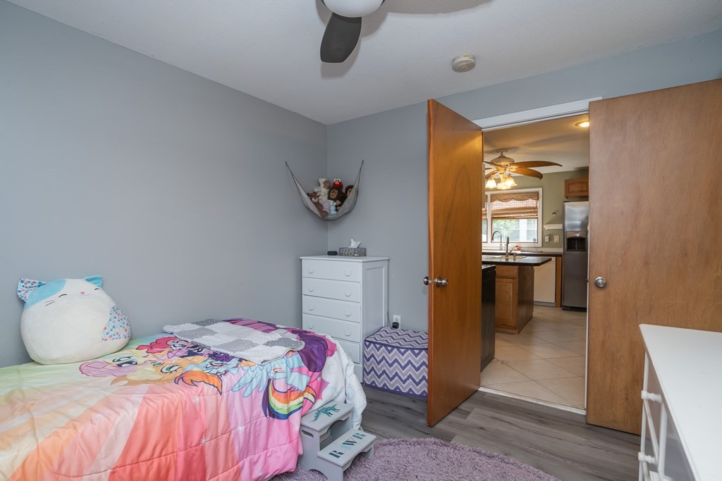 20 Rosella Street Springfield, MA 01118 - Photo 24 of 41 a bedroom with a bed and a refrigerator