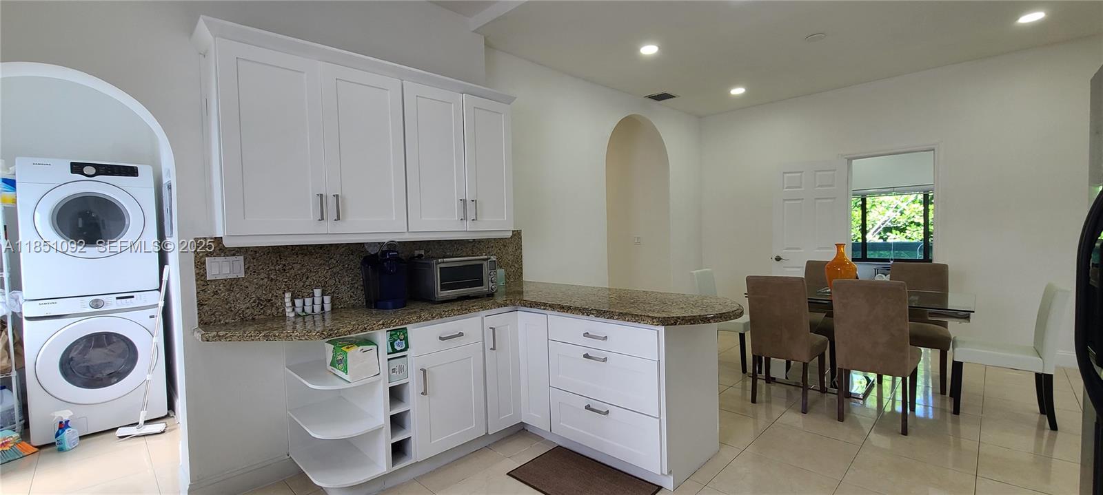 1721 Southwest 24th Terrace Miami, FL 33145 - Photo 21 of 80 a kitchen with stainless steel appliances granite countertop a sink a stove and a microwave