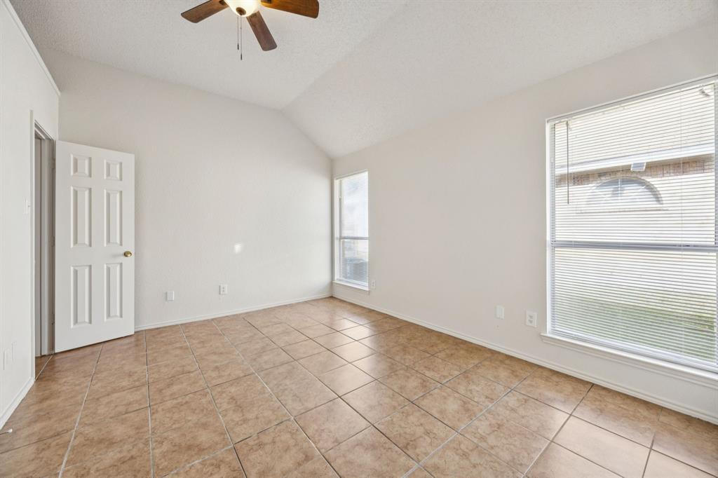 1602 Develon Drive Mesquite, TX 75149 - Photo 14 of 22 an empty room with ceiling fan and window
