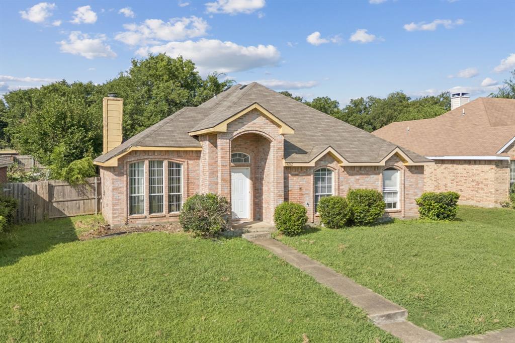 1602 Develon Drive Mesquite, TX 75149 - Photo 2 of 22 a front view of a house with garden