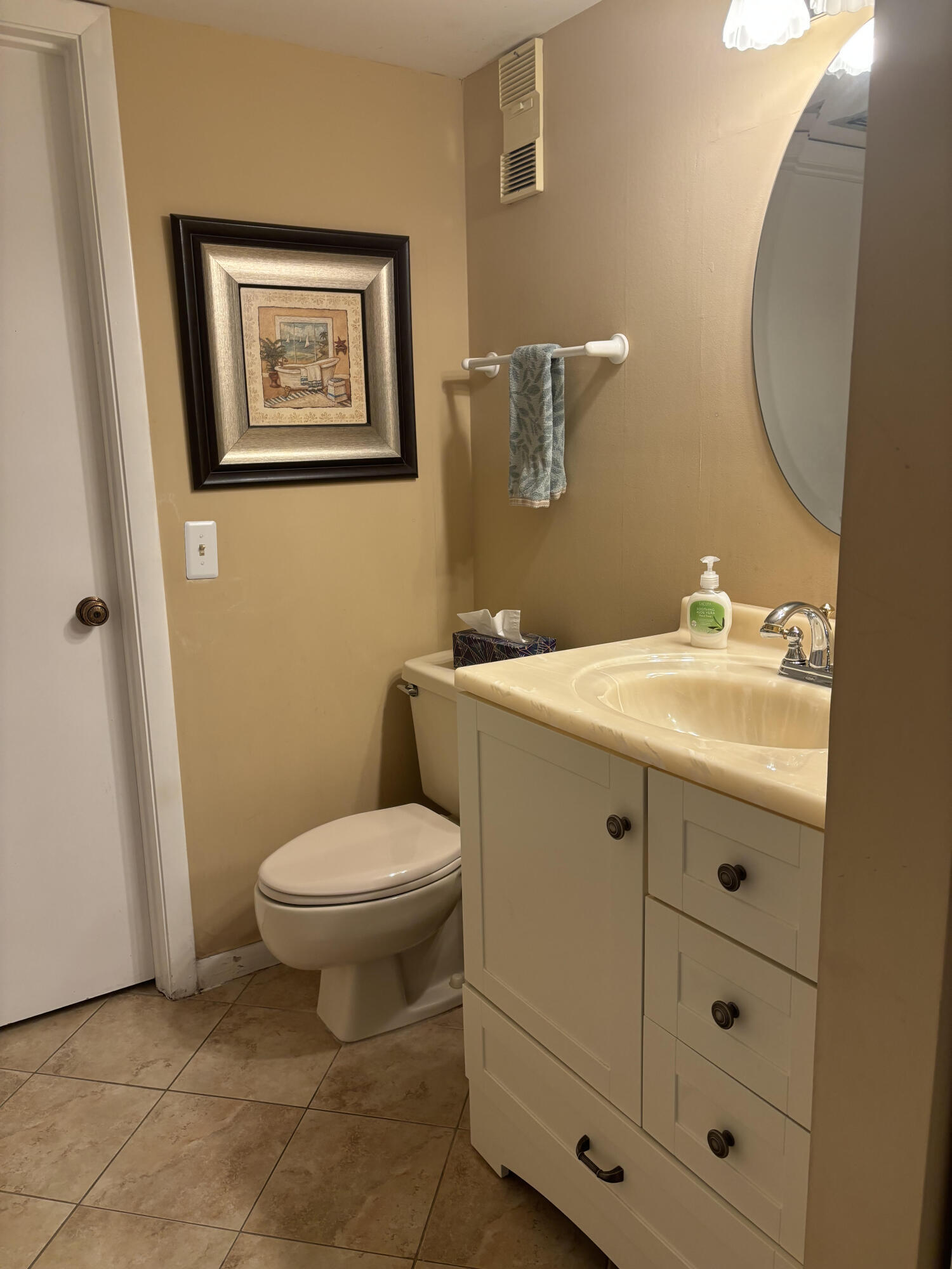 353 Highway 1, Unit A203 Jupiter, FL 33477 - Photo 23 of 26 a bathroom with a toilet sink and mirror