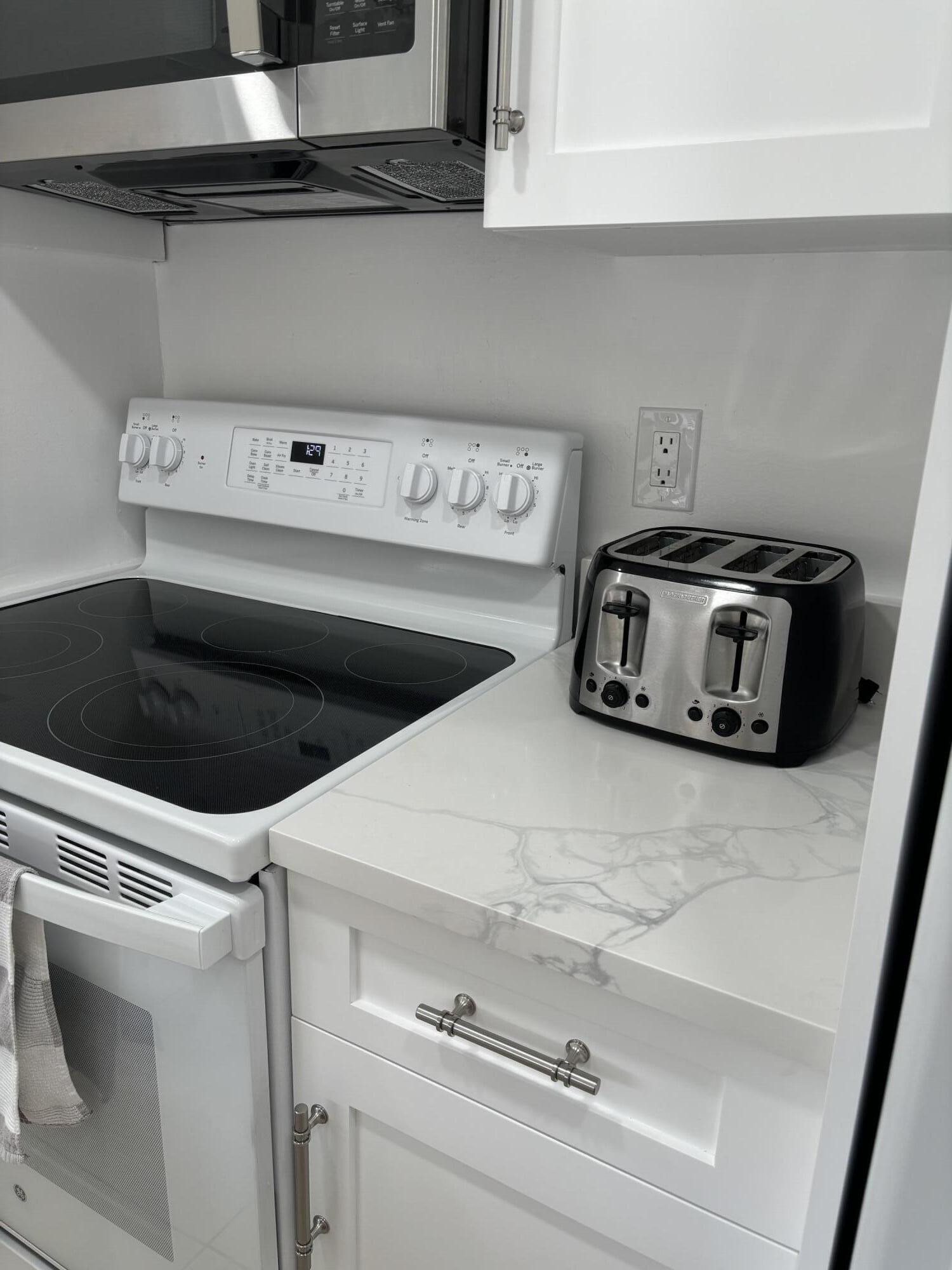 353 Highway 1, Unit A203 Jupiter, FL 33477 - Photo 24 of 26 a utility room with dryer and washer