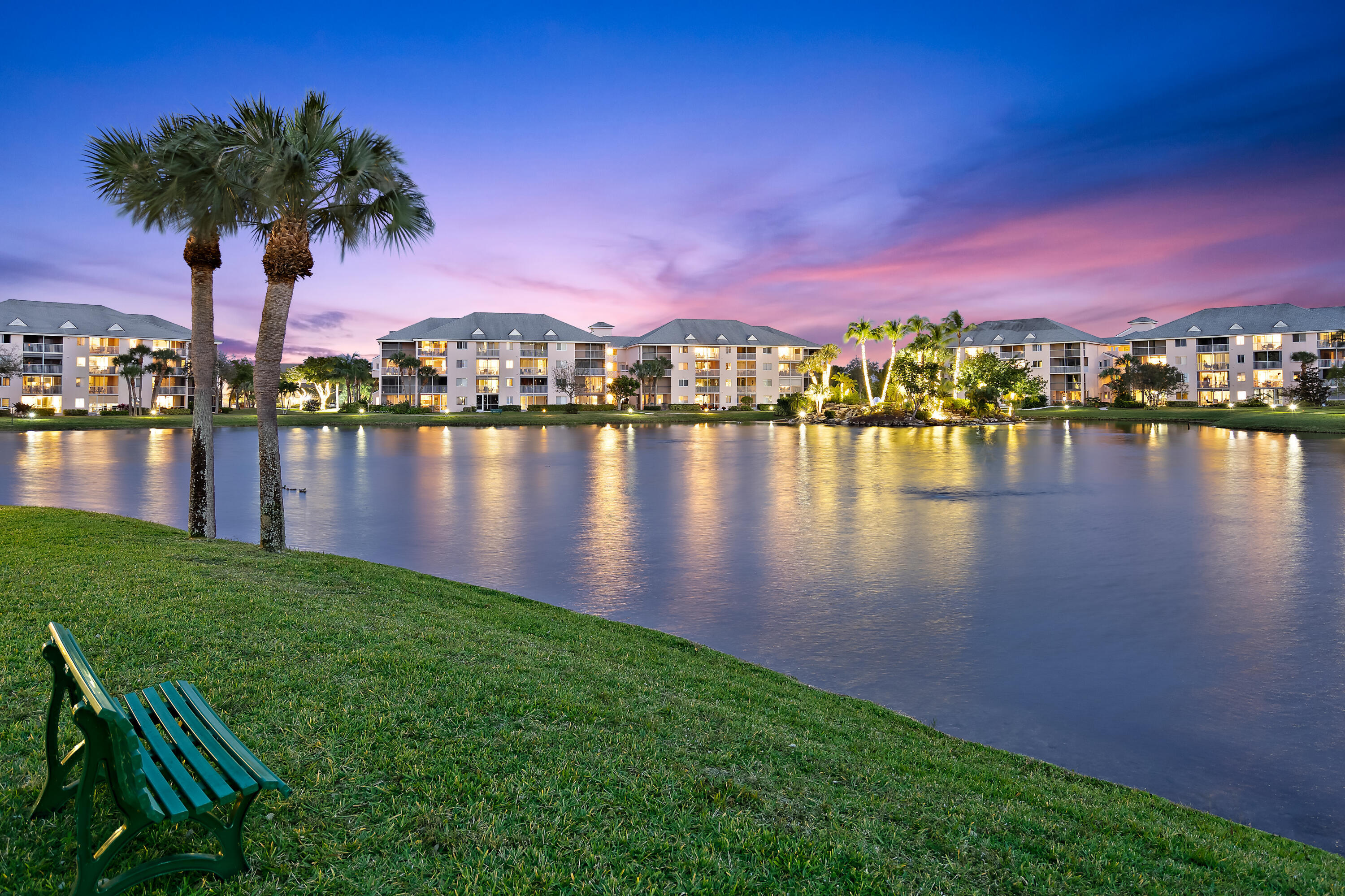 353 Highway 1, Unit A203 Jupiter, FL 33477 - Photo 4 of 26 a view of a lake with a table under an umbrella