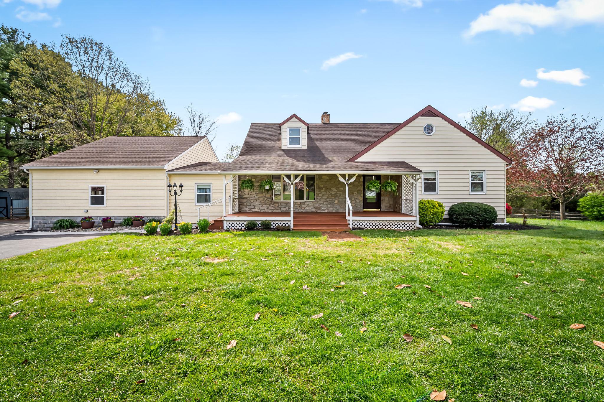 2619 Bradenbaugh Road White Hall, MD 21161 - Photo 1 of 50 a view of a house with a big yard and large trees