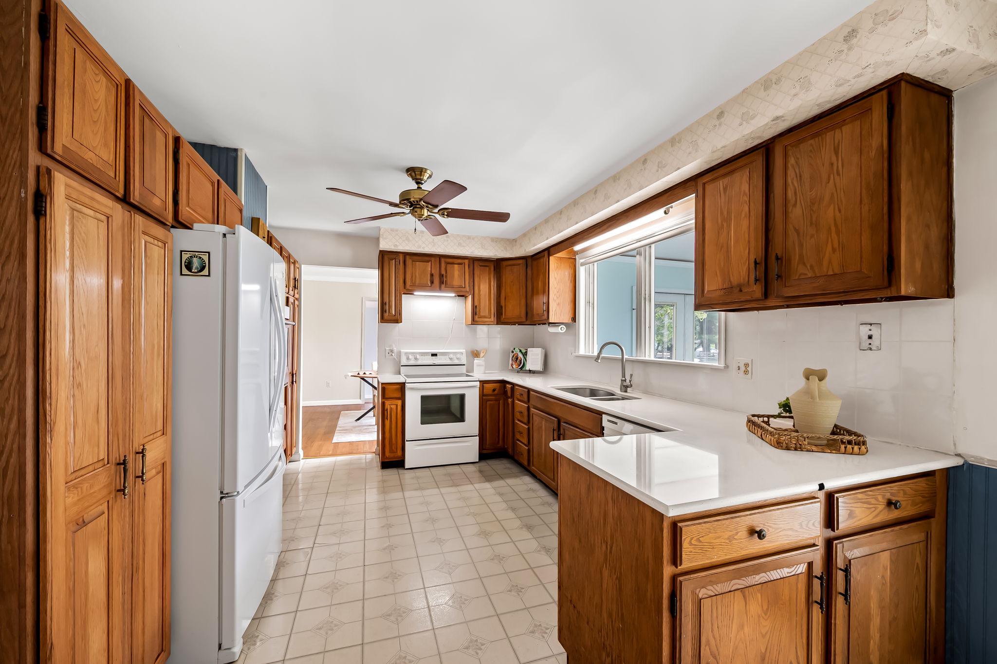 2619 Bradenbaugh Road White Hall, MD 21161 - Photo 13 of 50 a kitchen with stainless steel appliances granite countertop a sink stove and refrigerator