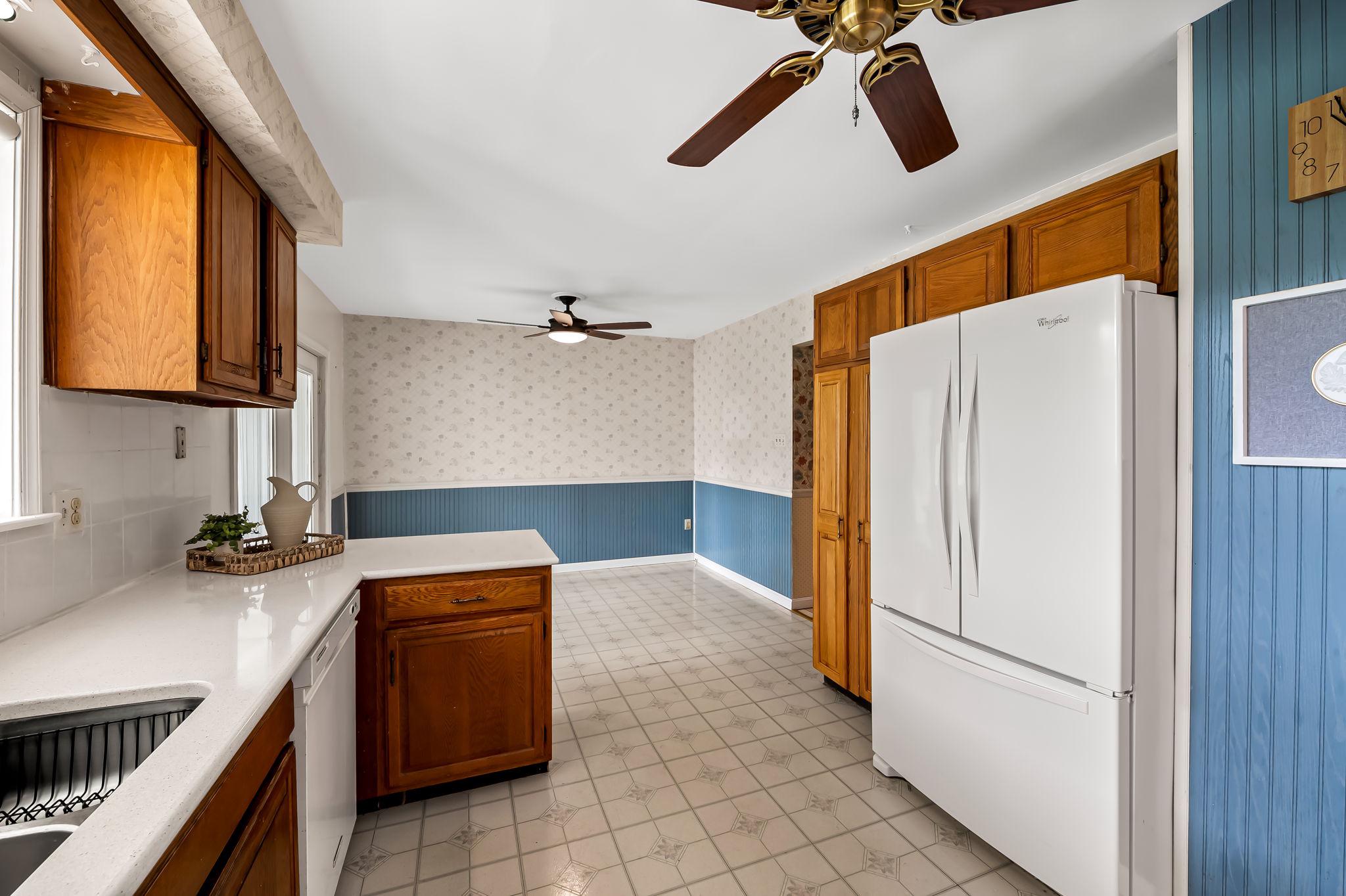 2619 Bradenbaugh Road White Hall, MD 21161 - Photo 15 of 50 a kitchen with a refrigerator and a sink