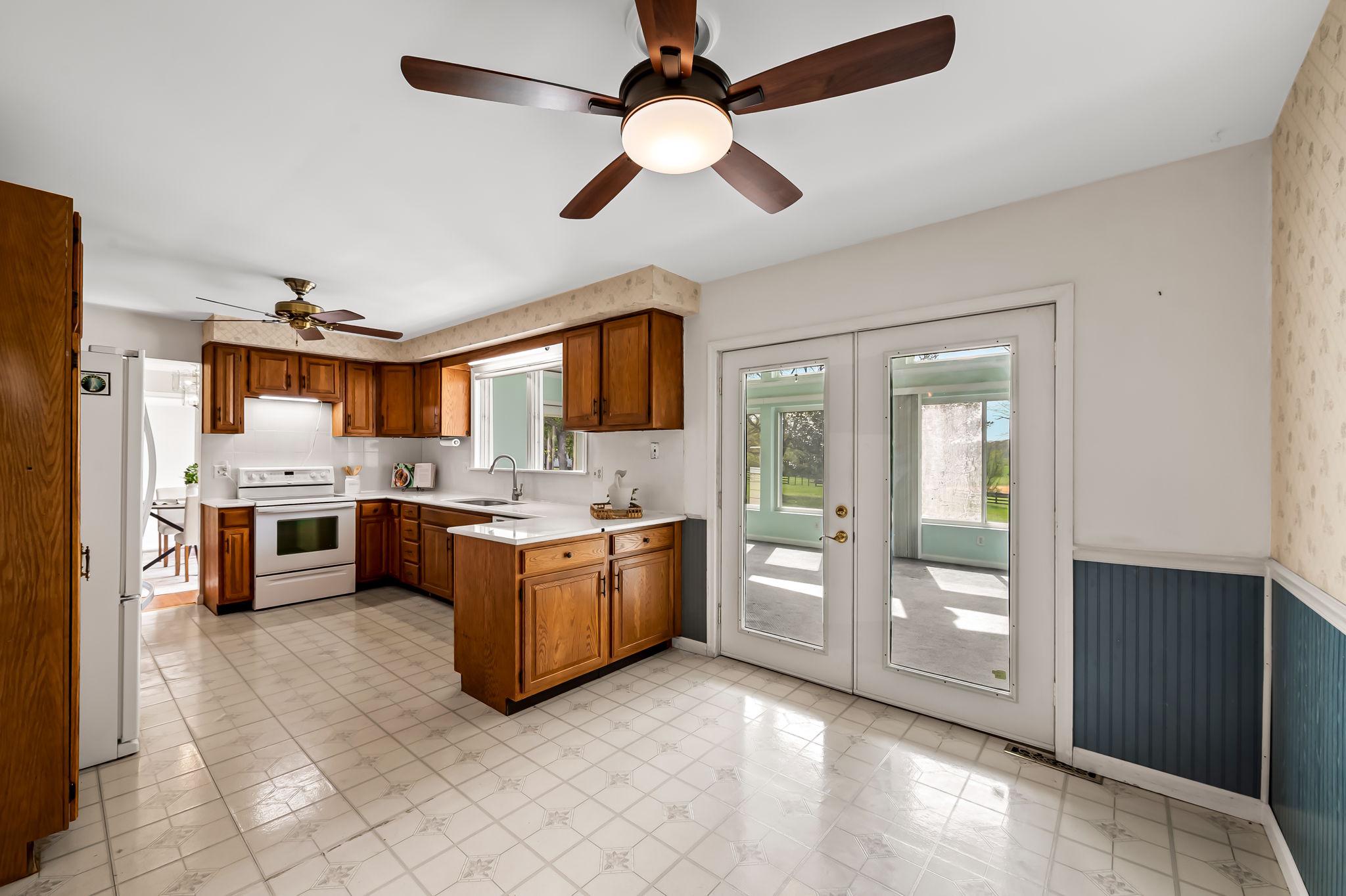 2619 Bradenbaugh Road White Hall, MD 21161 - Photo 18 of 50 a large kitchen with stainless steel appliances granite countertop a stove and a refrigerator