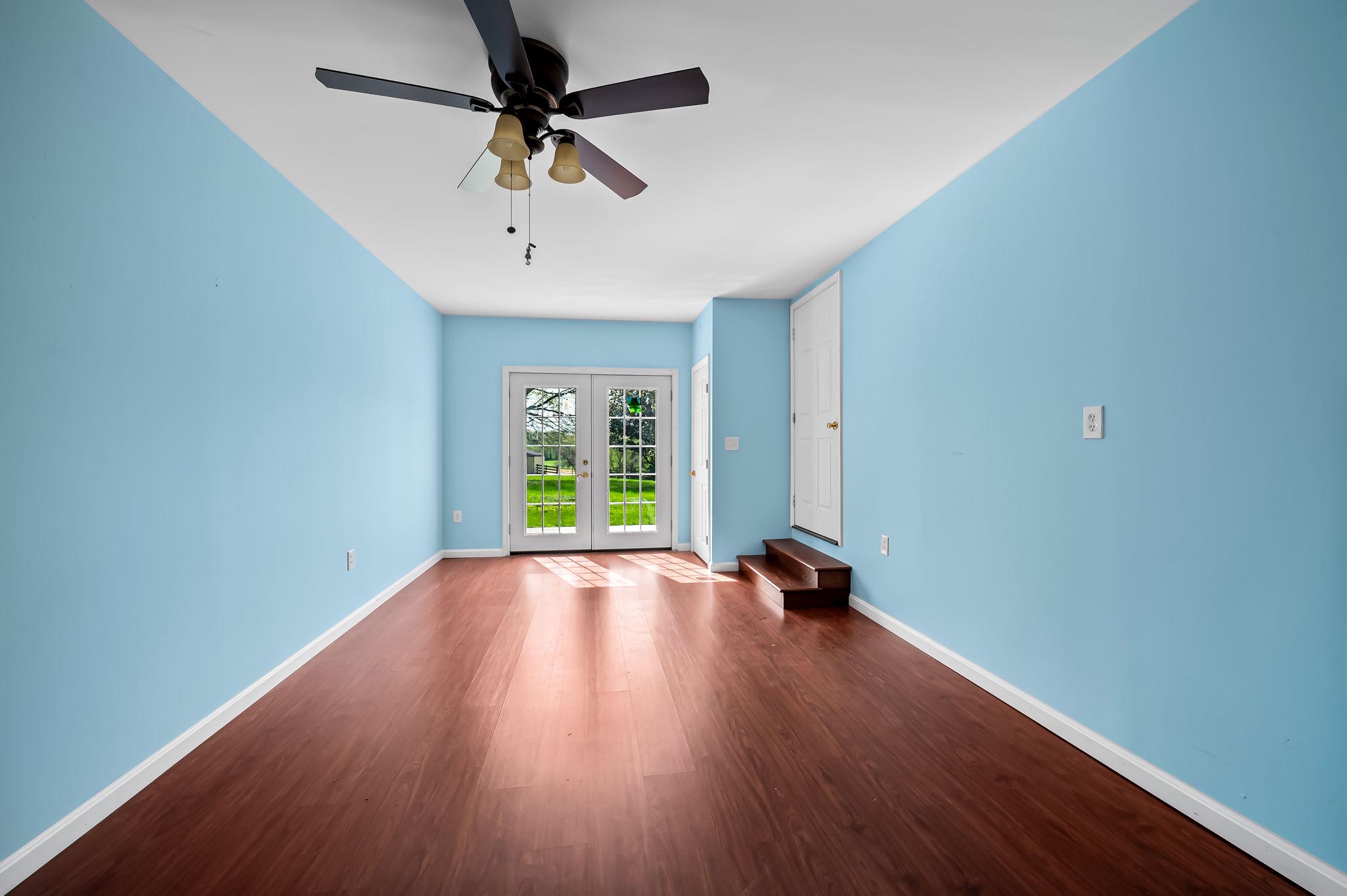 2619 Bradenbaugh Road White Hall, MD 21161 - Photo 20 of 50 a view of room with window ceiling fan and hardwood floor