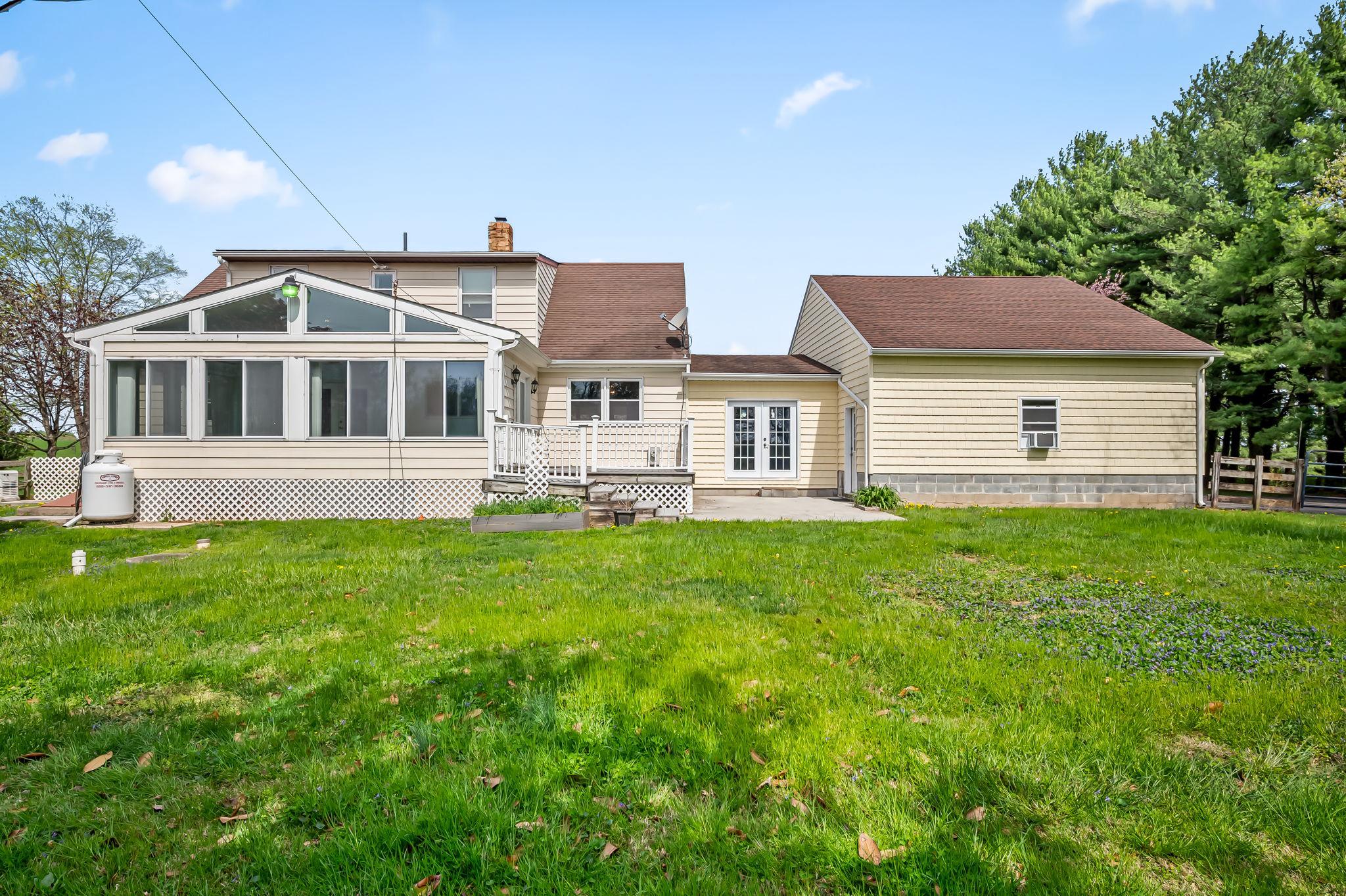 2619 Bradenbaugh Road White Hall, MD 21161 - Photo 42 of 50 a front view of a house with a garden and yard