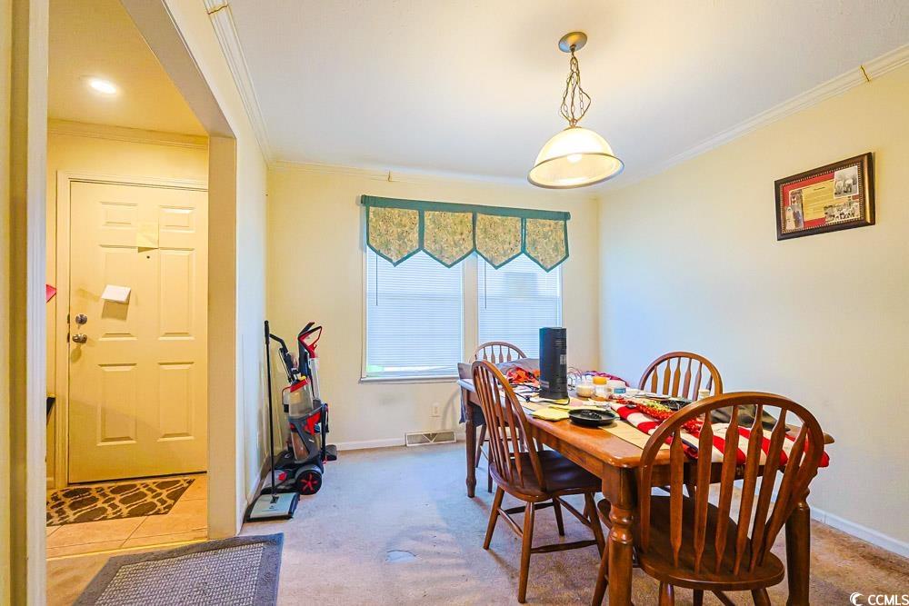1291 Highway 701 Highway Loris, SC 29569 - Photo 4 of 40 Carpeted dining area featuring ornamental molding
