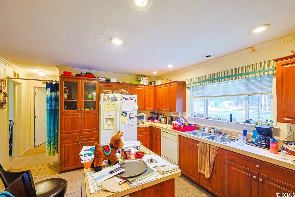 1291 Highway 701 Highway Loris, SC 29569 - Photo 5 of 40 Kitchen with crown molding, white appliances, light countertops, glass insert cabinets, and recessed lighting