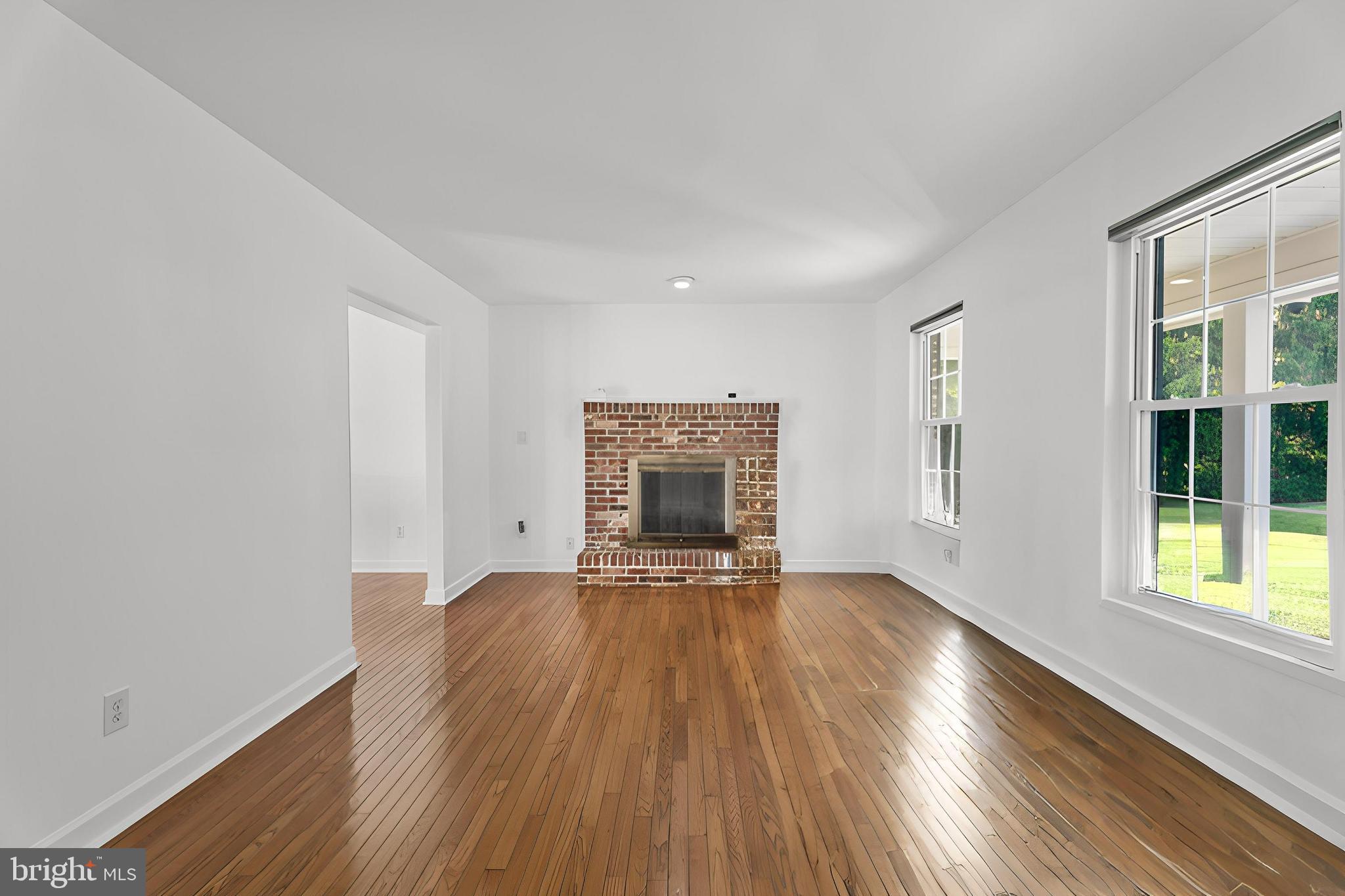 13054 Tarragon Road Reisterstown, MD 21136 - Photo 9 of 68 living room wood burning fireplace wood floors