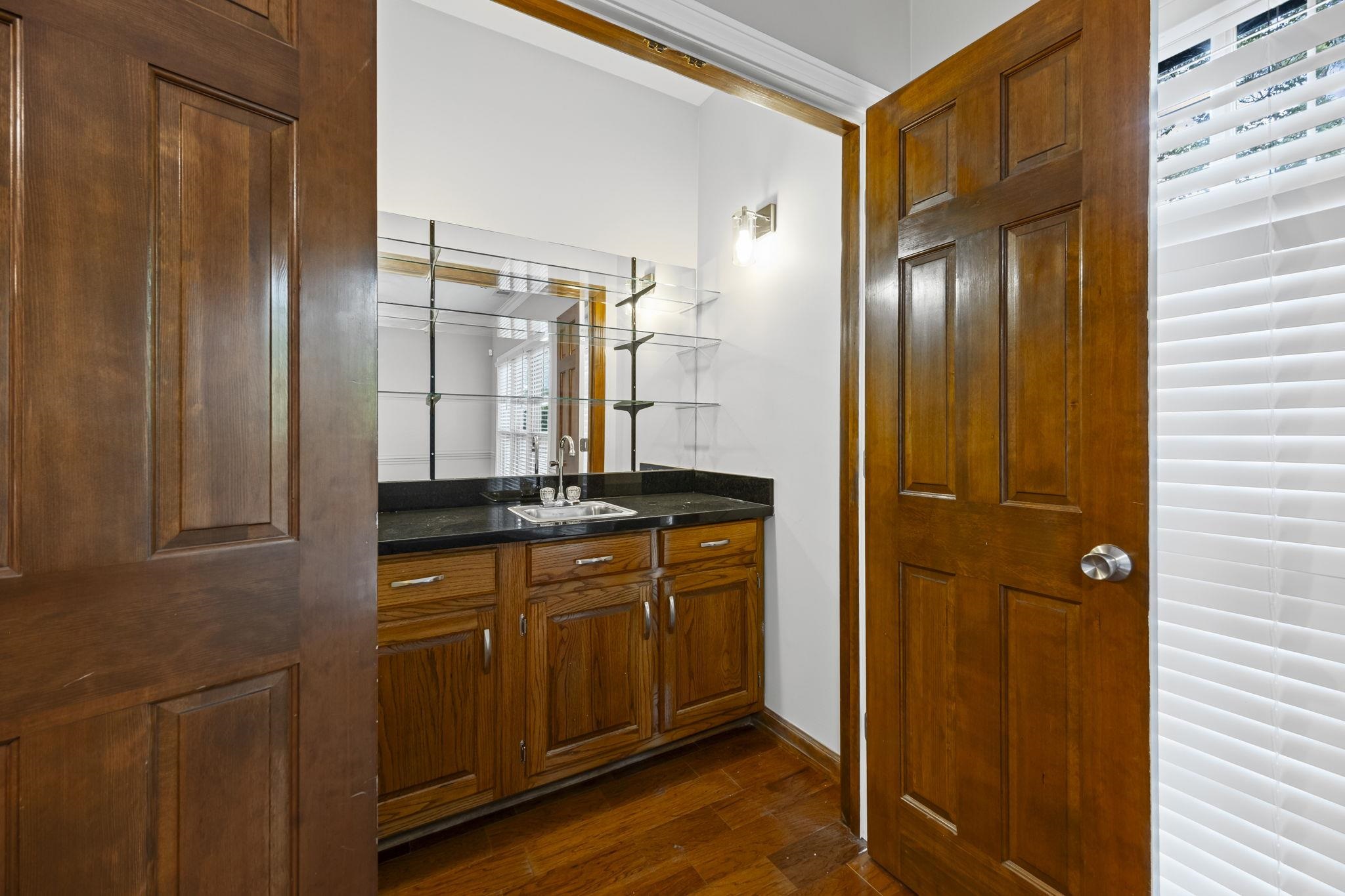 9190 East Bridge Drive Germantown, TN 38139 - Photo 7 of 37 Bathroom with vanity and dark wood-type flooring