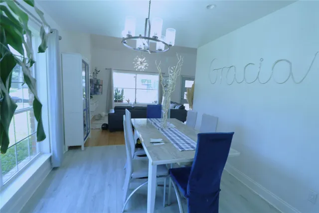 a bathroom with a granite countertop sink a toilet and a mirror