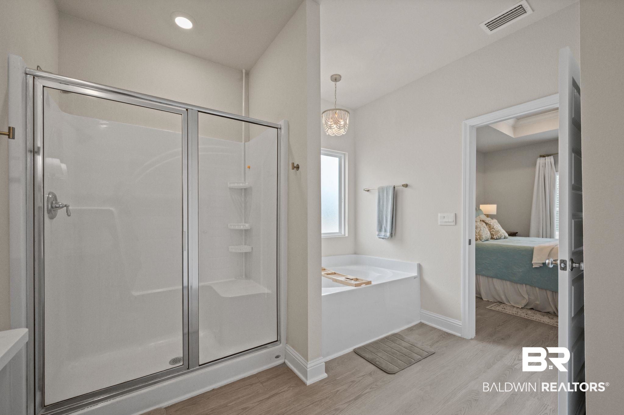 681 Calibre Street Fairhope, AL 36532 - Photo 35 of 56 Bathroom featuring shower with separate bathtub and hardwood / wood-style flooring