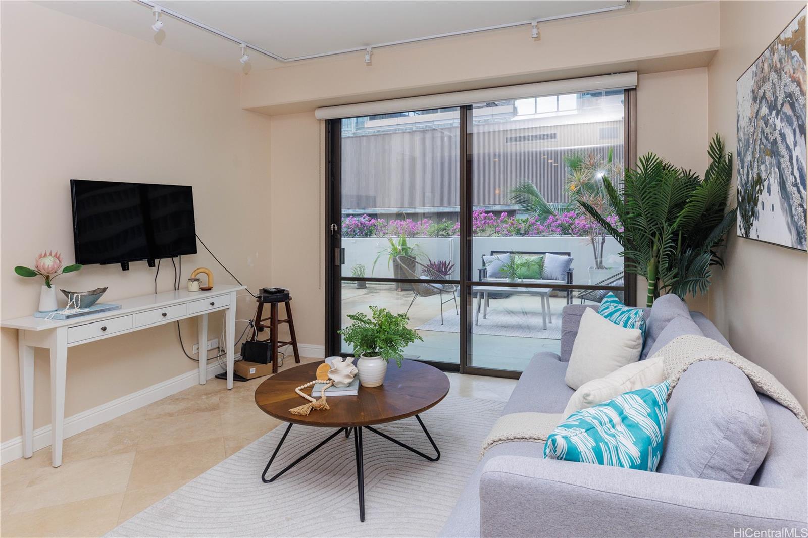 225 Queen Street, Unit 7A Honolulu, HI 96813 - Photo 3 of 18 a living room with furniture and a potted plant