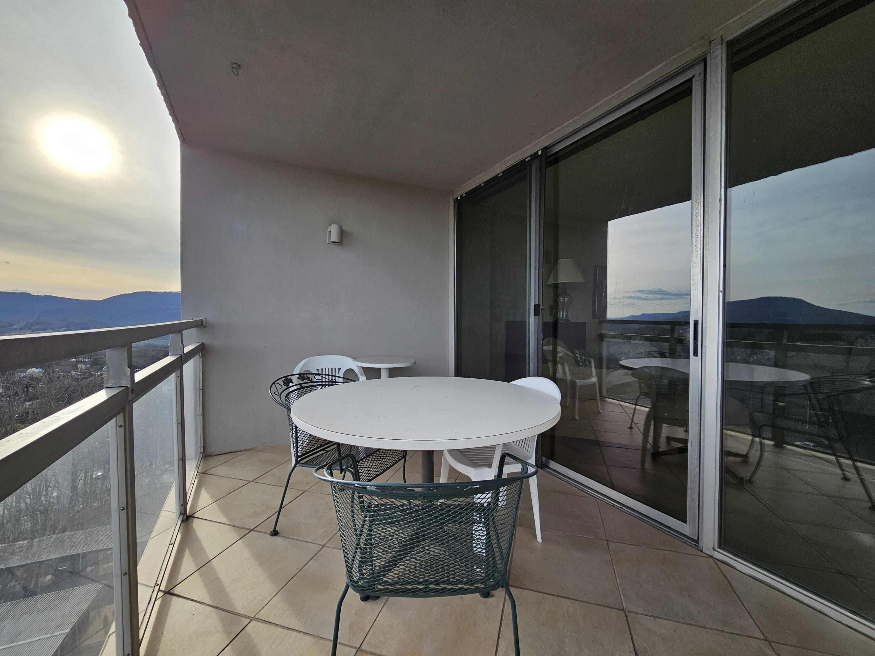 1131 Stringers Ridge Road, Unit 11E Chattanooga, TN 37405 - Photo 27 of 49 Balcony towards glass door (reflection)