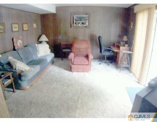 36 Maiden Way Colonia, NJ 07067 - Photo 5 of 8 a living room with furniture and a window
