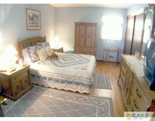 36 Maiden Way Colonia, NJ 07067 - Photo 6 of 8 a bed room with a bed