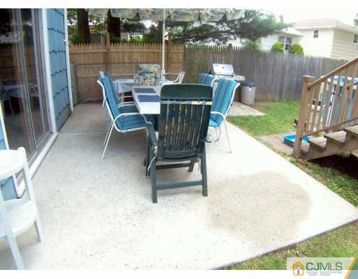 36 Maiden Way Colonia, NJ 07067 - Photo 7 of 8 a swimming pool with outdoor seating and yard