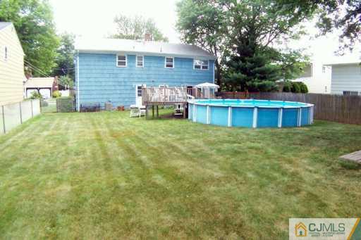 36 Maiden Way Colonia, NJ 07067 - Photo 8 of 8 a view of a house with a backyard