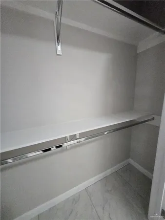 a view of a room with racks on the wall