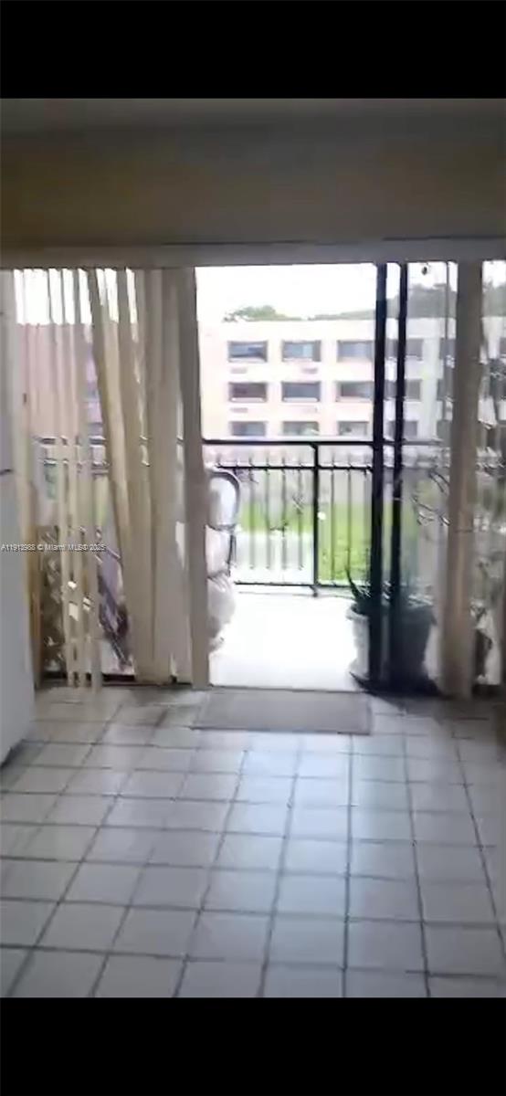 Golden Glades Miami, FL 33161 - Photo 2 of 18 a view of empty room with floor to ceiling window