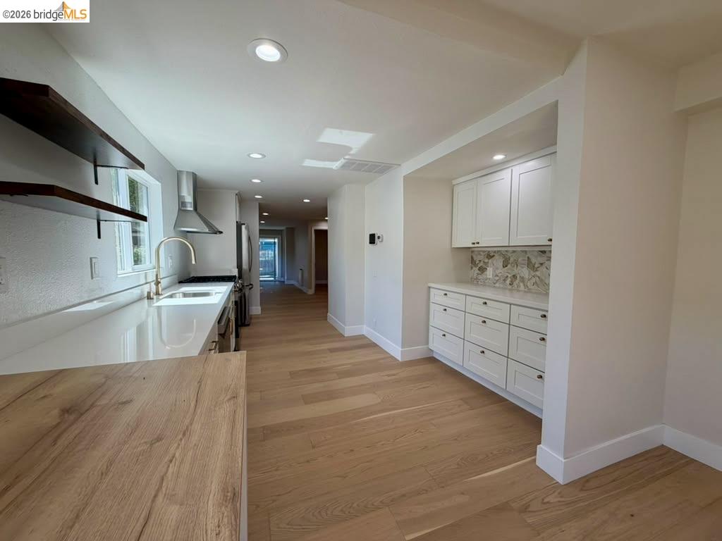 1327 Ward Street Berkeley, CA 94702 - Photo 7 of 8 a view of a kitchen with a sink and cabinets