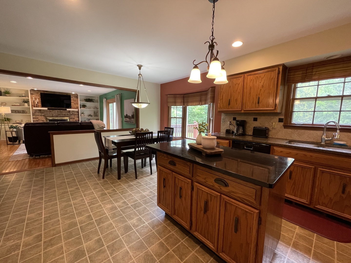 2006 Dorset Drive Wheaton, IL 60189 - Photo 3 of 10 a kitchen with granite countertop a sink a counter top space appliances and cabinets